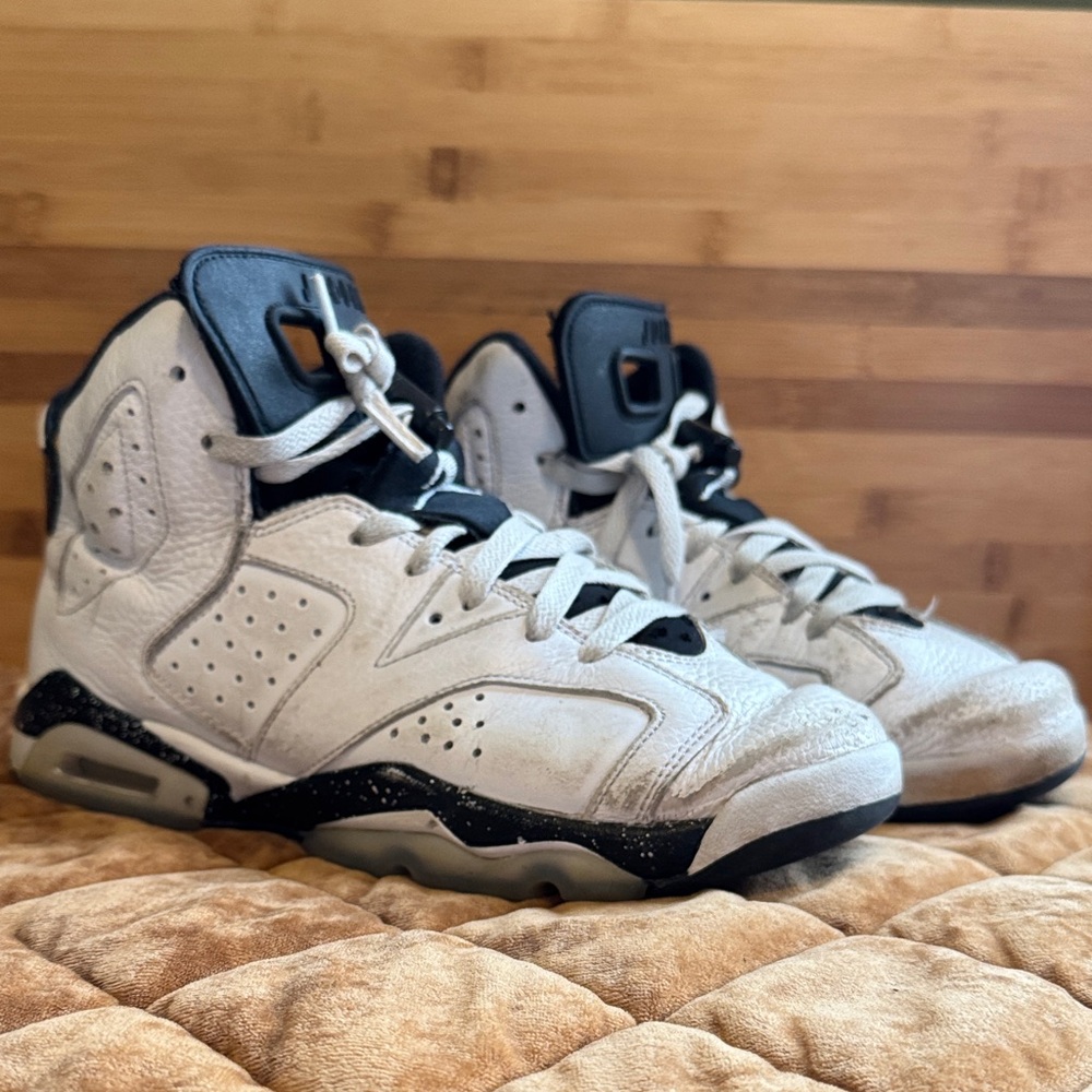 Nike Air Jordan’s White and Black High-Top Sneakers